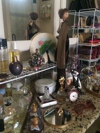 Perfume bottles and other toiletries;  tall slender "Yolanda" figure (with papers)