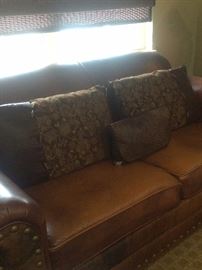 Leather Western sofa has matching love seat