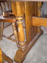 Dining room table with two leaves, 4 side chairs & 2 captain chairs. (1capt chair has broken arms-could be armless chair easily)