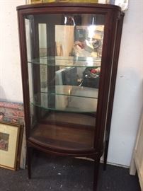 Antique china cabinet & display case.            Serpentine glass Federal period