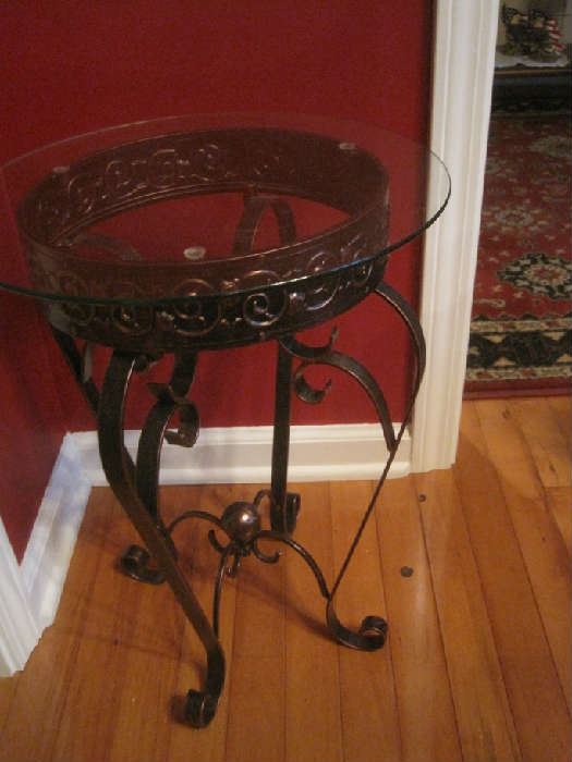 Small round glass top iron table