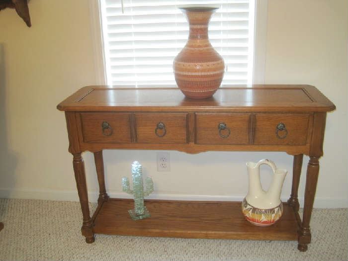 Sofa table with Native American pottery and crystal cactus