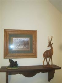Wooden shelf with hand carved deer, framed bear print, black bear figuerine