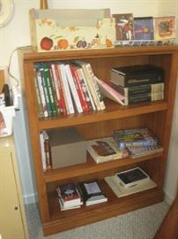 Bookcase with  Southern Living cookbooks,  CD's by popular artists 