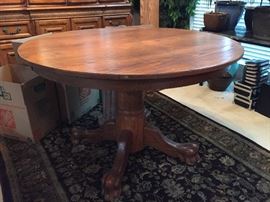 Round solid wood table with leaf