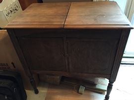 Antique victrola cabinet. Would look great painted to use as a tv stand or piece for your entryway. Lots of storage inside