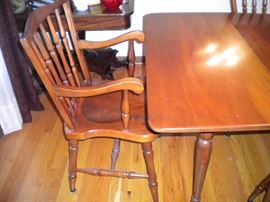 Stunning Solid Cherry Dining Room Table with several leaves and 6 chairs(2 are Captain) Beautiful with fold in legs and drop leaf.