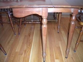 Stunning Solid Cherry Dining Room Table with several leaves and 6 chairs(2 are Captain) Beautiful with fold in legs and drop leaf.