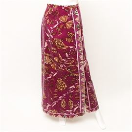 Vintage Emilio Pucci Velvet Wrap Skirt: A vintage Emilio Pucci velvet wrap skirt. This skirt features butterfly and floral motifs through out the entire skirt and dates from the late 1960’s to the early 1970’s. There is a border of butterflies with a light pink band. All of the colors featured in this velvet skirt are purple, pink, brown, and tans. There are snap button closures to the waist along with a hook and eye. The one tag reads Exclusively for Saks Fifth Avenue, Italy. The other tag reads Emilio Pucci, Florence – Italy, Made in Italy, size 10