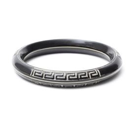 Vintage 1920s Celluloid Greek Key Bracelet: A vintage celluloid Greek key bangle bracelet. The bracelet features a repeating black and white Greek key design around the perimeter of the bangle.