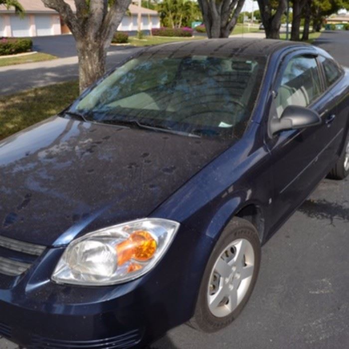2008 Chevrolet Cobalt LS Sedan: A navy 2-door 2008 Chevrolet Cobalt LS sedan with gray cloth interior seats, automatic transmission, and 20691 miles. VIN is 1G1AK18F987123456.