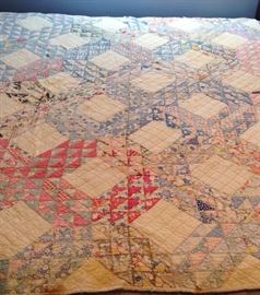 Hand quilted very old quilt featuring 30's material.