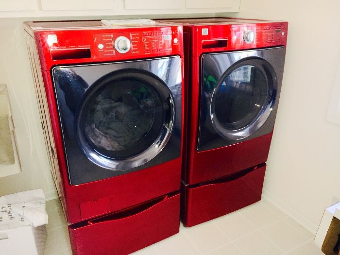 Kenmore Elite Front loading washer and gas dryer with pedestals.