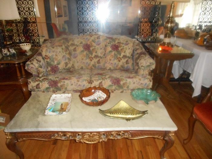 marble top coffee table and floral love seat