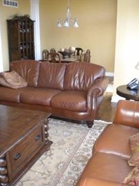 Famous Barr - Leather living room set.. Leather with rolled arms and nailhead trim. Sofa/couch, chair and loveseat.  Dining table and six chairs & China cabinet/Buffet/Hutch. Eddie Bauer coffee and end table. Pottery barn large area rug.