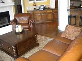 Famous Barr - Leather living room set.. Leather with rolled arms and nailhead trim. Sofa/couch, chair and loveseat. Eddie Bauer coffee and end table. Pottery barn large area rug.