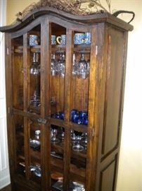 Dining room table with tile top southwest flair, 6 chairs and matching China cabinet/buffet-hutch.