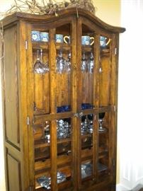 Dining room table with tile top southwest flair, 6 chairs and matching China cabinet/buffet-hutch.