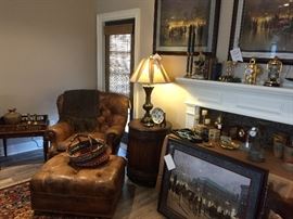Leather Hemingway chair and ottoman. We have another leather club chair and ottoman, G. Harvey prints