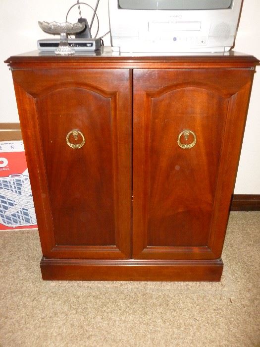 This is a nice vintage stereo cabinet with shelves