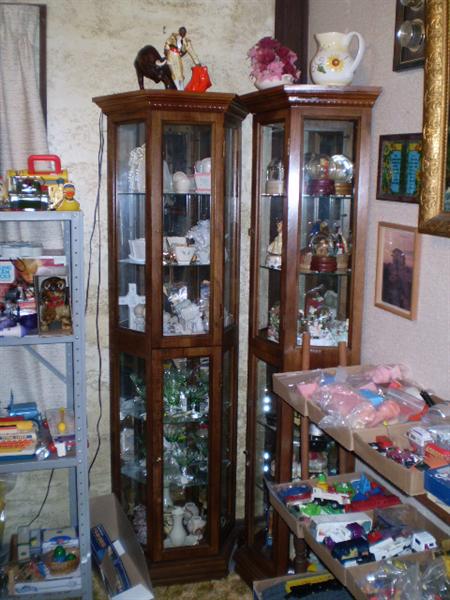 2 Curio cabinets with 3 sides and the back is mirrored.  The 2 could be put back to back to make a hexagonal shape.