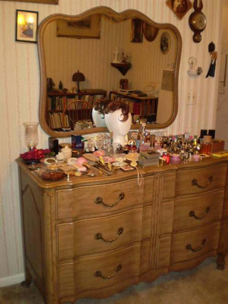 Dresser.  Large collection of perfume bottles.