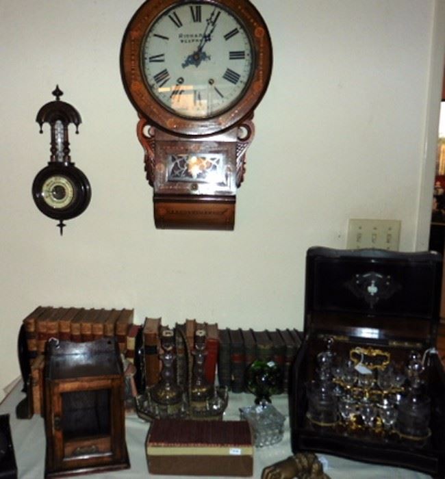 Antique books, humidor, tantalus, clock