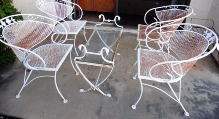 Wrought iron chairs, table with swan heads