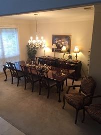 BEAUTIFUL 12 seat dining table 6 chairs 3 leaves and always been cover - finish is in primo condition and in the back ground  