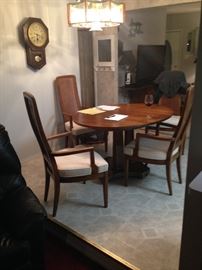 Solid wood table with four arm chairs and two leafs