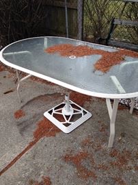 Glass top patio table, there are six chairs also that can go with that