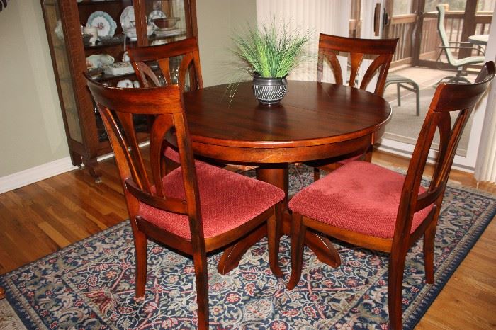 Nice table with leaves enclosed, 4 chairs, rug