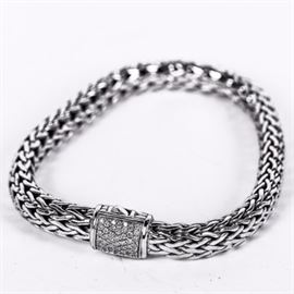 John Hardy Sterling Silver and Diamond Wheat Bracelet: A John Hardy sterling silver wheat bracelet with a push button clasp encrusted with pavé set diamonds. It presents with an orange JH polishing cloth in a black display box.