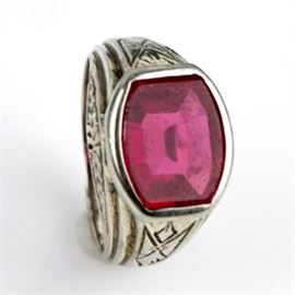Men's Vintage 14K White Gold and Synthetic Ruby Ring: A men’s vintage 14K white gold ring featuring a center bezel set synthetic ruby mounted on decoratively carved shank.