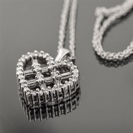 14K White Gold and Diamond Cross-Hatch Heart Pendant: A 14K white gold pendant necklace featuring an open heart pendant accented by a cross-hatch pattern to the center hanging on a link chain with a spring ring clasp.