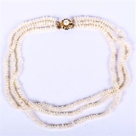 Multi-Strand Freshwater Pearl Necklace: A pearl necklace featuring three strands of cultured freshwater pearls measuring 4.5 mm – 6.00 mm. It has a sterling silver box clasp accented by a faux pearl and measures approximately 16.25" long. The clasp is marked “Sterling”.