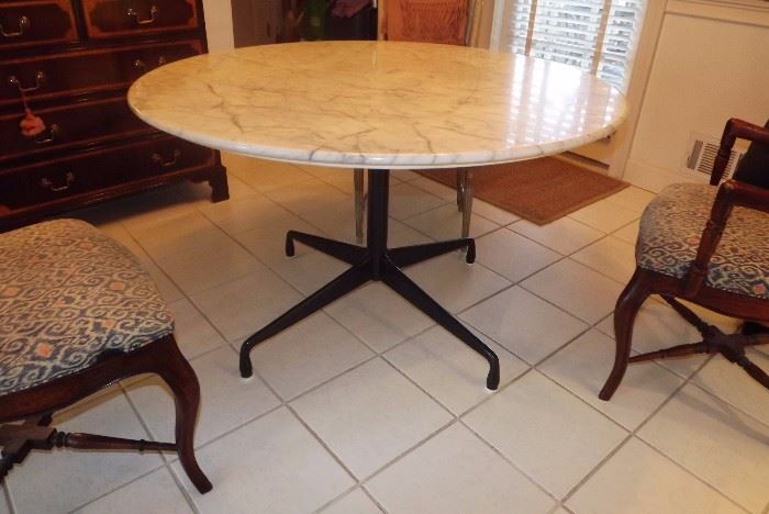 Herman Miller Eames Round Table with Segmented Base. Table has marble top (there is a crack in the marble that has been repaired). Table diameter is 48 inches.