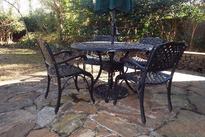 Wrought iron table with 4-chairs, umbrella and base