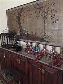 Another Asian wall screen; long marble top server; foreign dolls 