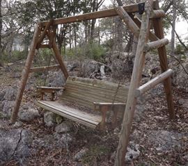 Outdoor swing set with A&MM logo