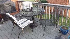 Wrought Iron patio table, chairs and umbrella