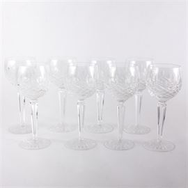 Waterford Crystal "Lismore" Wine Hock Glasses: A set of eight Waterford Lismore crystal wine hock glasses. Each glass features a cut crystal spherical well, a hexagonal stem, and a round starburst pattern base. They bear the Waterford watermark on the undersides.