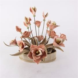 Ceramic Flower Centerpiece by Winifred Cole of California: A ceramic centerpiece by Winifred Cole of California. This piece features ceramic pink flowers attached to the ceramic base by metal rods. The centerpiece has a tag that reads “Original Nature Studies by Winifred Cole of California”.