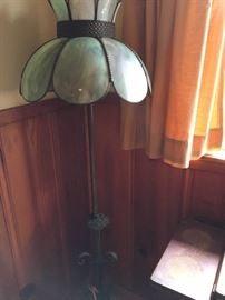 Antique floor lamp with green slag glass tiffany style shade