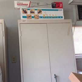 One of the two nice steel cabinets with a metal detector and a universal rotisserie on top