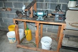 Work table with grinders and saws