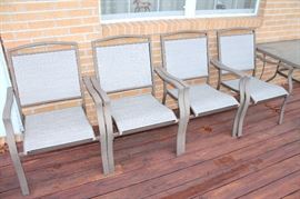 Glass-top patio table with 6 chairs