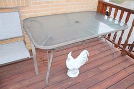 Glass-top patio table with 6 chairs
