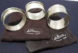 Trio of sterling silver napkin rings, including early 1900's JT&S, Birmingham, Eng, oval shape with zigzag & diamond pattern, at one time one side had monogram initials which have worn off, approx. 1.5" x 2" across by 1" band, WEB Sterling monogrammed AMM round napkin ring, 2" across by 3/4" band, and round antique German, Wilhelm Binder napkin ring, approx. 2" across by 1 1/4" band. Total weight is 61.6 grams.
