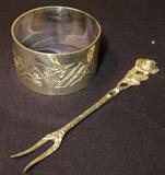 Silver Plated group including Reed & Barton Christmas Bell, approx. 3"h x 2.5"w, Oneida Ltd. Silversmiths spoon, approx. 5 3/4"l x 1.5"w and three napkin rings approx. 1.5" across x 1" wide band.